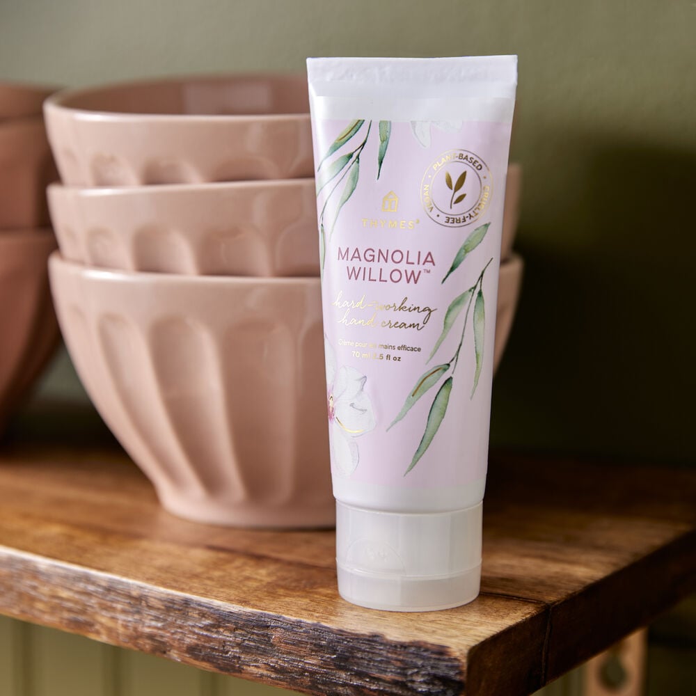 Thymes Magnolia Willow Hard-Working Hand Cream on a shelf with bowls image number 1